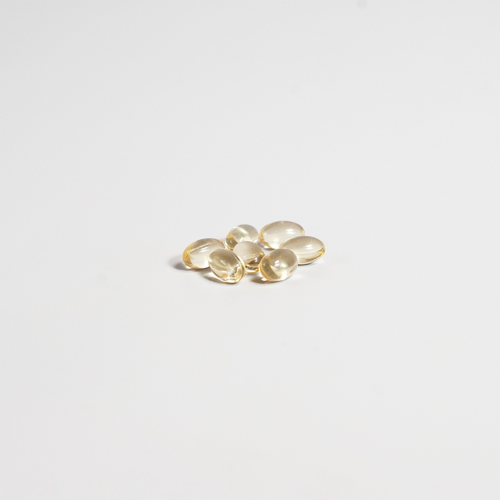 Gold oval-shaped objects on a light gray background