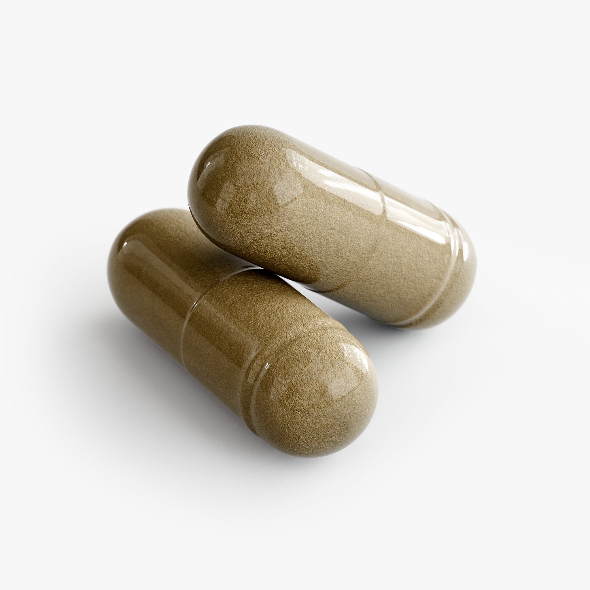Two brown capsules on a white background
