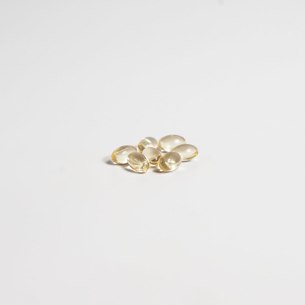 Gold oval-shaped objects on a light gray background