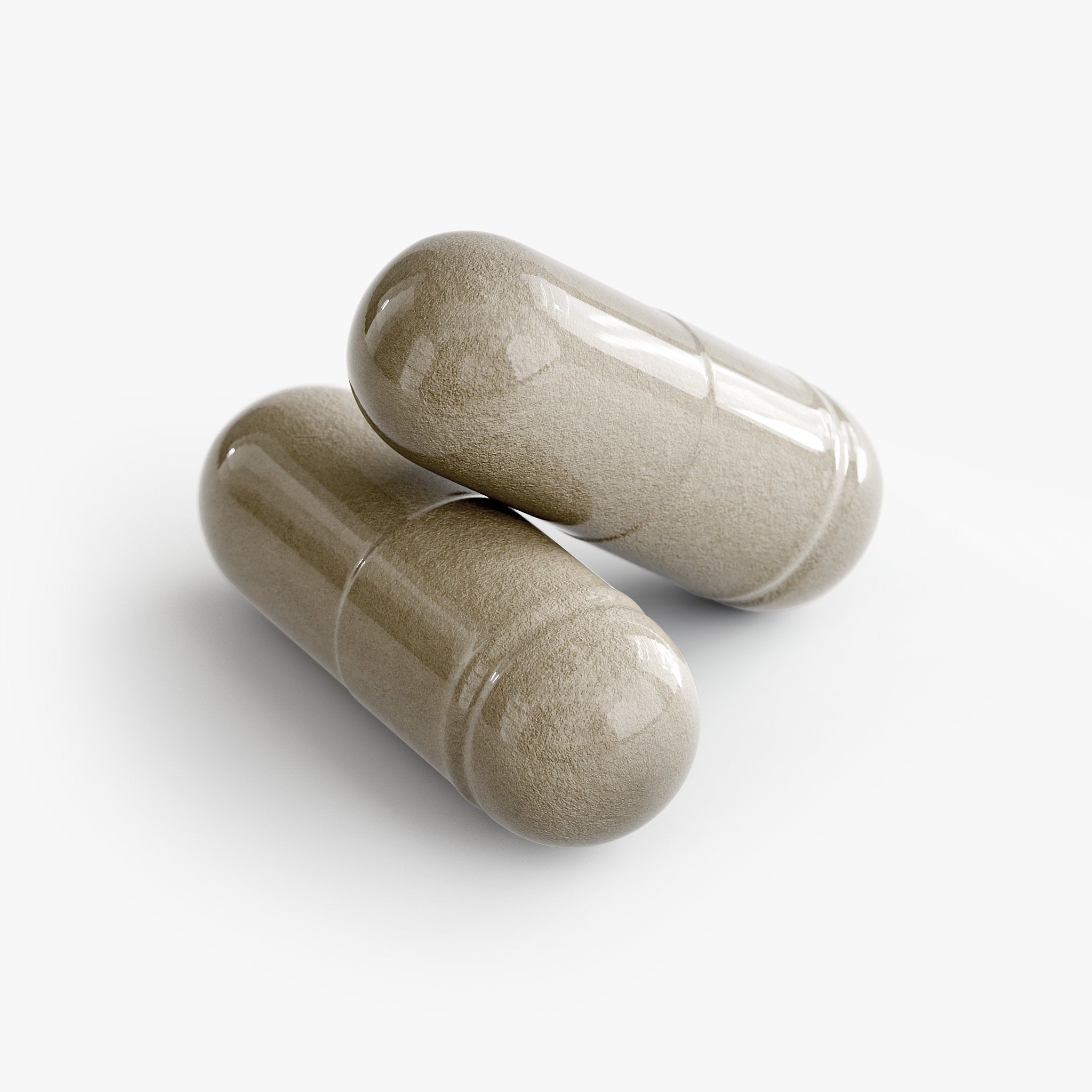 Two beige capsules on a white background