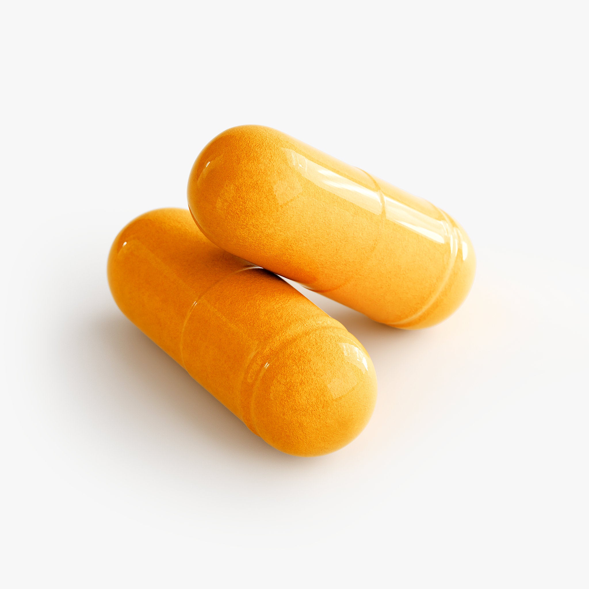 Two orange capsules on a white background